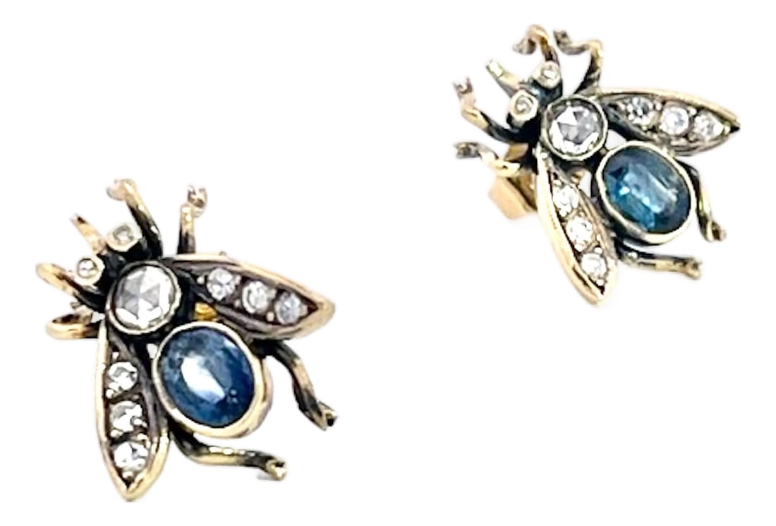 Antique Gold and Silver Bee Earrings With Sapphires and Diamonds, Pair: This is a striking pair of antique-style bee (or fly) earrings, crafted in gold with oxidized silver detailing that gives the insects' bodies a dark, aged contrast. Each bee features a sparkling