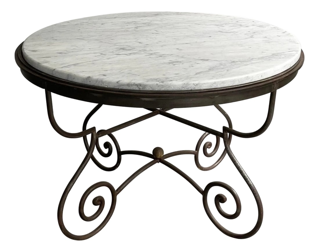 Mid 20th Century Hollywood Regency Scrolled Steel & Marble Dining Table: Craftsman made, Hollywood Regency, round marble dining table features a beautifully scrolled steel base with brass ball detail. The white and gray marble shows wonderful veining and compliments the