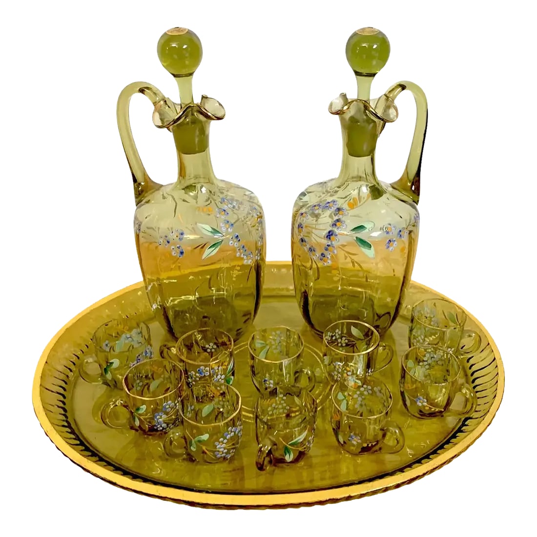 19th Century Moser Aesthetic Enameled Cordial/ Liquor Set - Set of 15: Moser Aesthetic enameled Cordial/ liquor set,15-pieces. Subtle olive green glass, with naturalistic enamel work with gilt highlights. Consisting of two handled decanters with stoppers, Ten handled