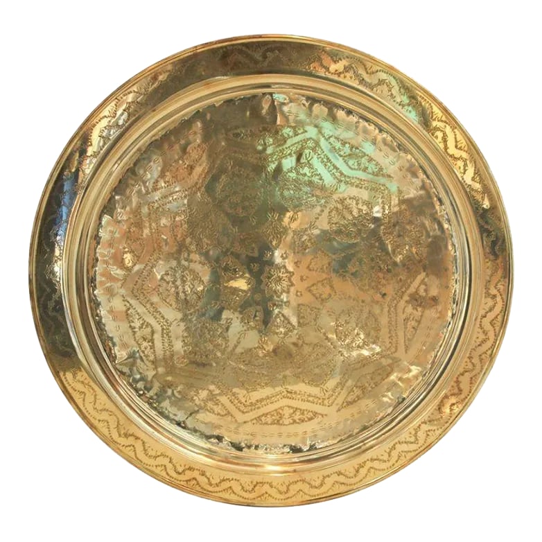 Circa 1900s Monumental Moroccan Brass Tray Platter: Monumental Moroccan metal brass tray platter. Polished decorative metal brass tray with very fine intricate designs. Hand-hammered and chiseled in floral Moorish style with a large lotus flower in