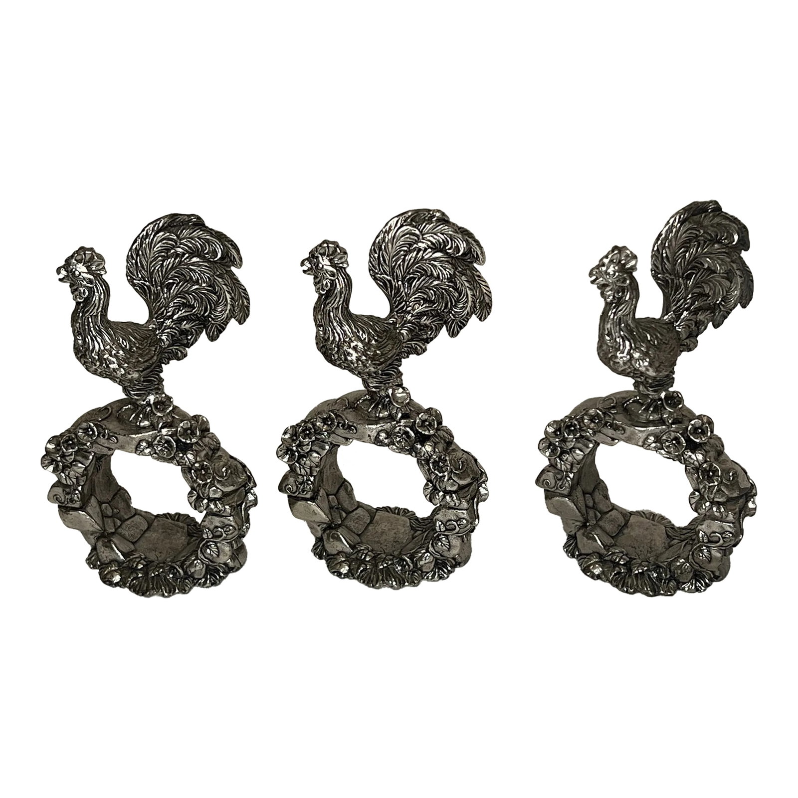 Reed and Barton Silver Rooster Napkin Rings From 1824 Collection Set of 3: Significant rooster napkin rings by Reed and Barton. They are from the 1824 collection, which were designed to commemorate the company's founding in 1824. Enjoy the fine detail, meticulous