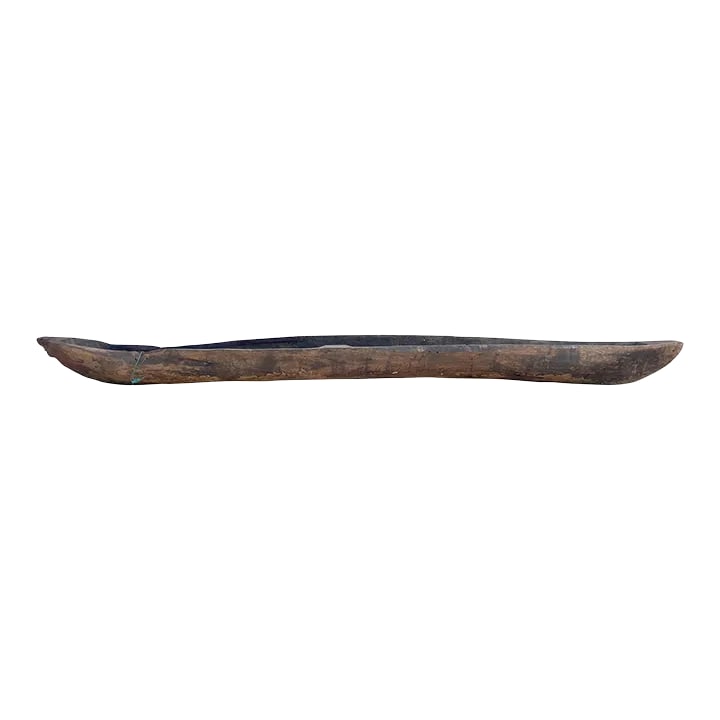 200" Long Antique Primitive Wooden Canoe: An exceptional early 20th century antique wooden canoe crafted from a single tree trunk through primitive construction techniques. This antique wooden canoe is a true relic from the past and Its