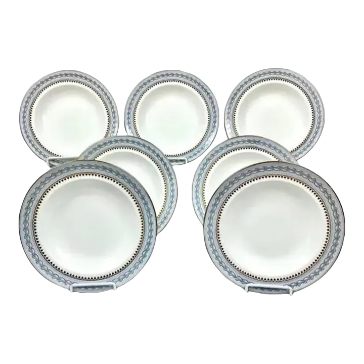 Set of Seven Late 19th/Early 20th Century Wedgwood Bone China Soup Bowls: Beautiful Set of Seven (7) 19th Century Wedgwood Bone China Soup Bowls. Each bowl has a white center with gold, light blue and white pattern on one inch rim, gold trim surrounds bowl. On the reverse