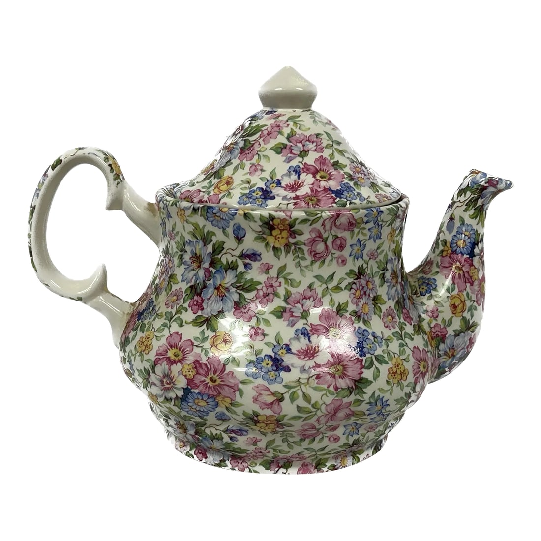 Vintage English Staffordshire Laura Chintz Teapot: Charming Late 19th Century English porcelain Laura Chintz pattern teapot. Made in Staffordshire, England. Sweet small floral pattern in the colors of pink, blue, green and yellow on a cream