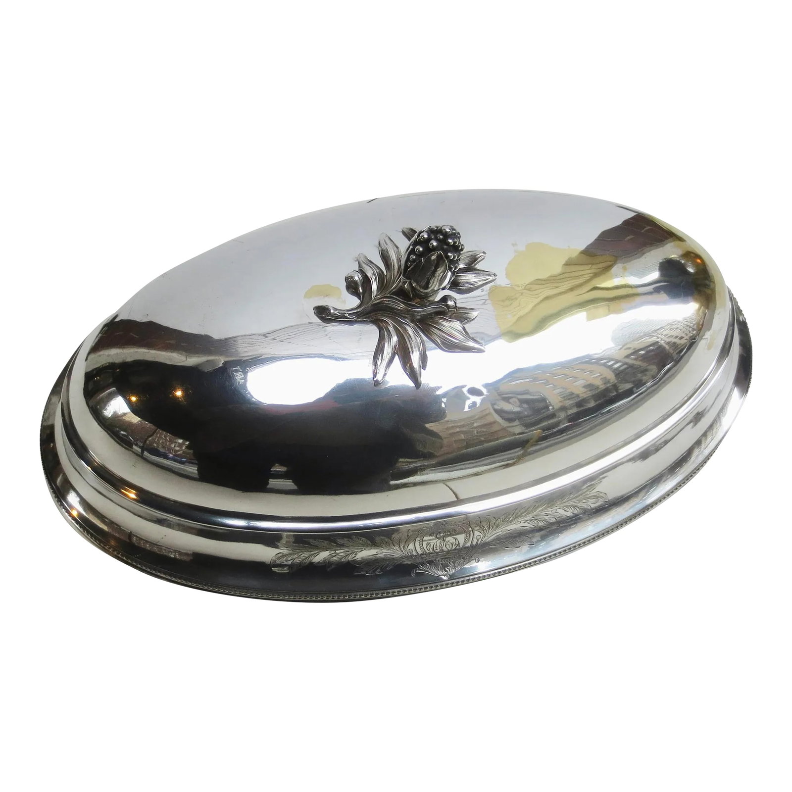 Christofle Silver Plate Serving Dome Circa 1900: Christofle silver-plated serving dome. A focal point of the table, the Grand entrance of the main course. Beautifully crested by a flowering fruit with foliage. and banded by a beaded rim and crested 