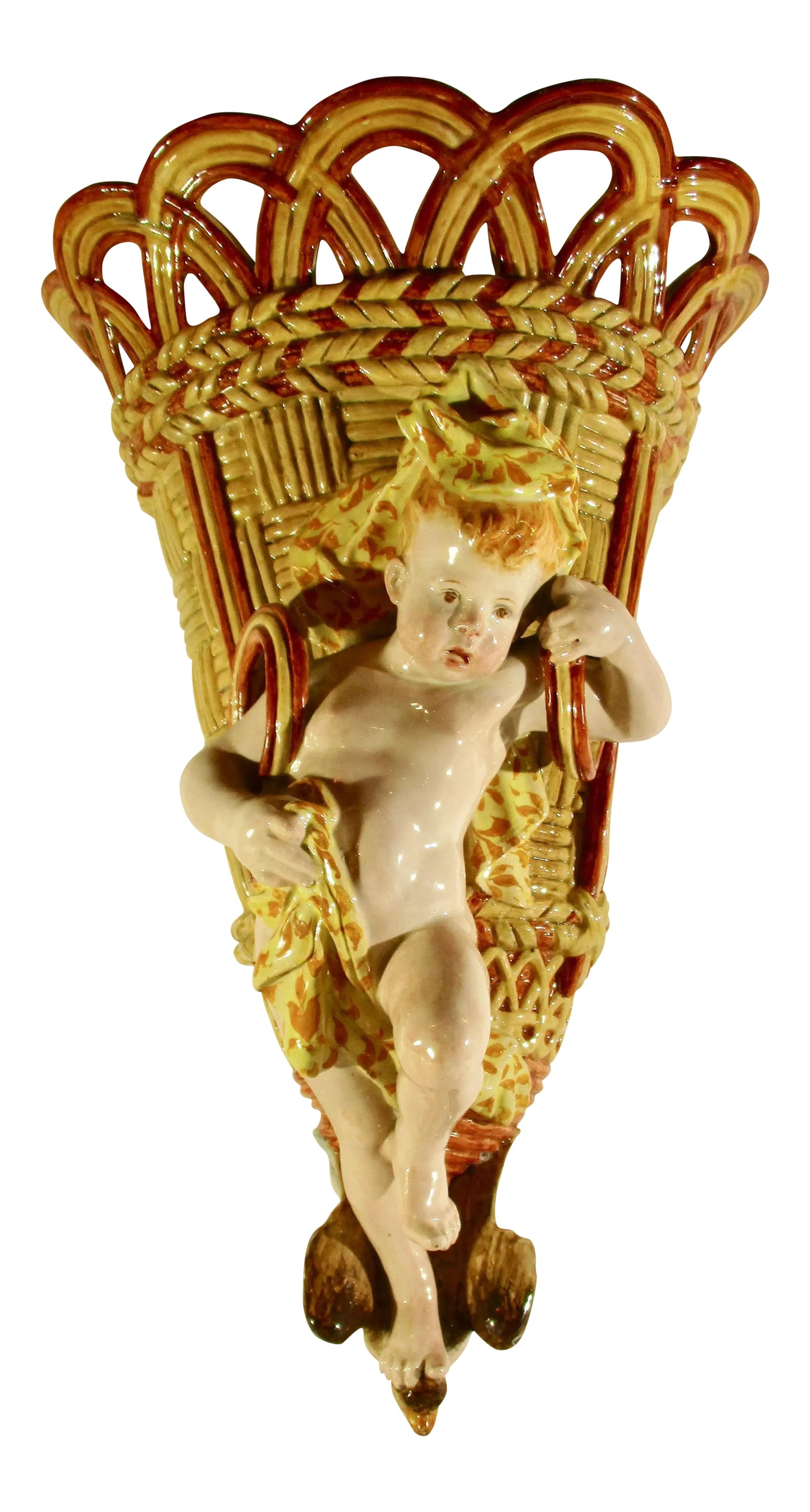 19th Century Ginori Majolica Wall Pocket: Ginori 19th century wall pocket in image of putti carrying a large grape basket. Shoulder straps over each shoulder as the putti steps forward. Lively expression on face and animated body pose.