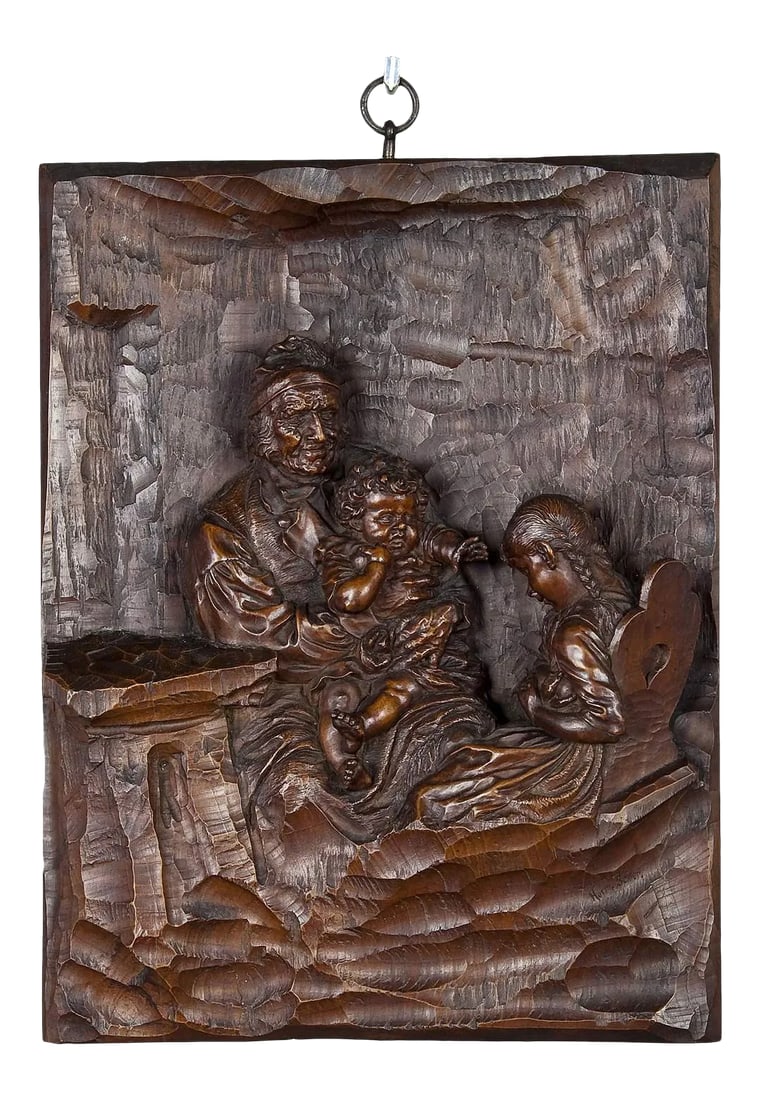 19th Century Relief Woodcarving by Hermann Steiner Meran: Relief Woodcarving by Hermann Steiner Meran 19th century The wooden carved relief shows a grandfather with grandson on his lap. The granddaughter is sitting on the chair and hides a ball from her
