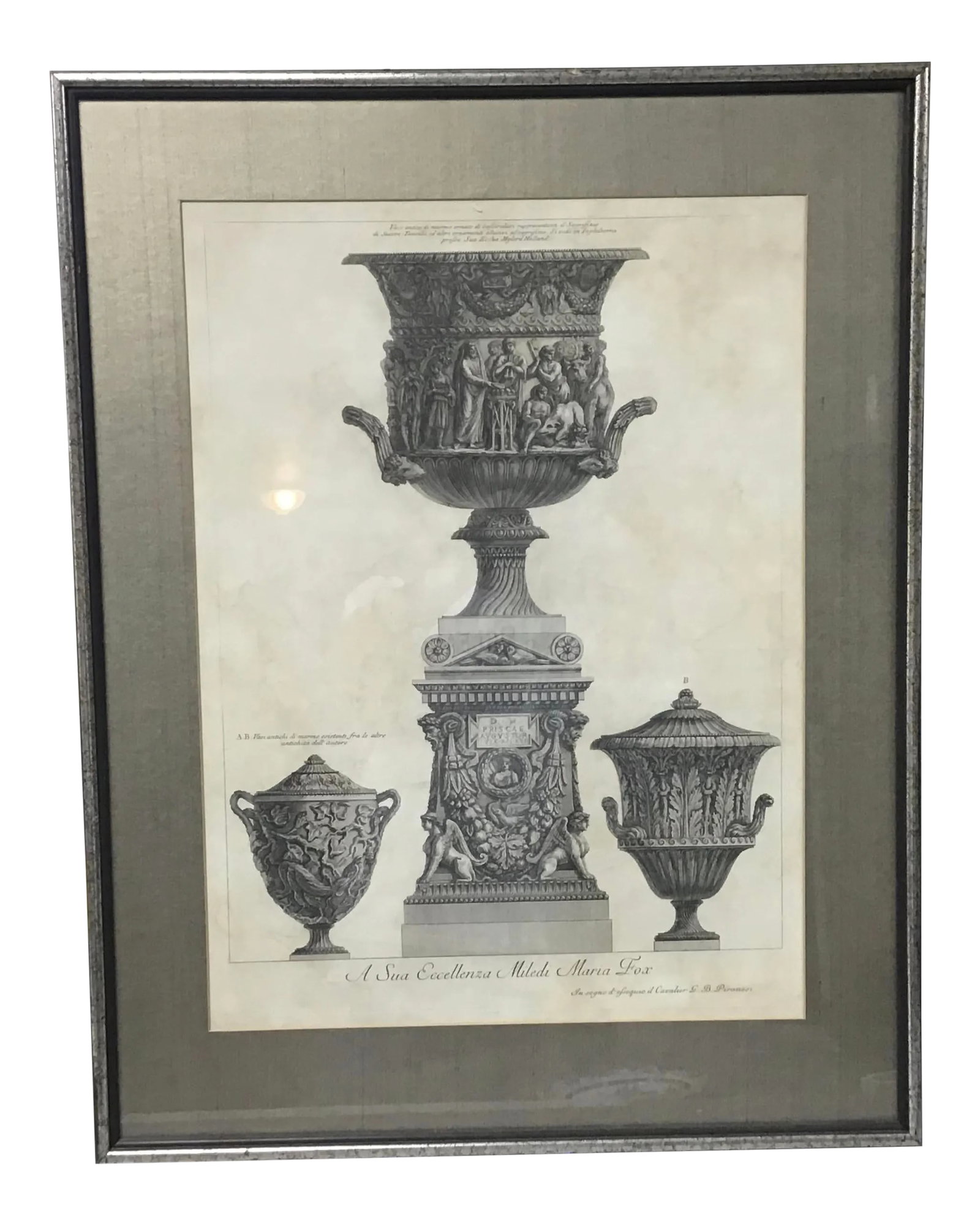 Three Marble Vases and a Sarcophagus. Etching by g.b. Piranesi,: The central vase is carved with a priest and worshippers sacrificing the suovetaurilia (a boar, a ram and a bull), and is placed on a sarcophagus guarded by winged sphinxes. The left vase is carved wi