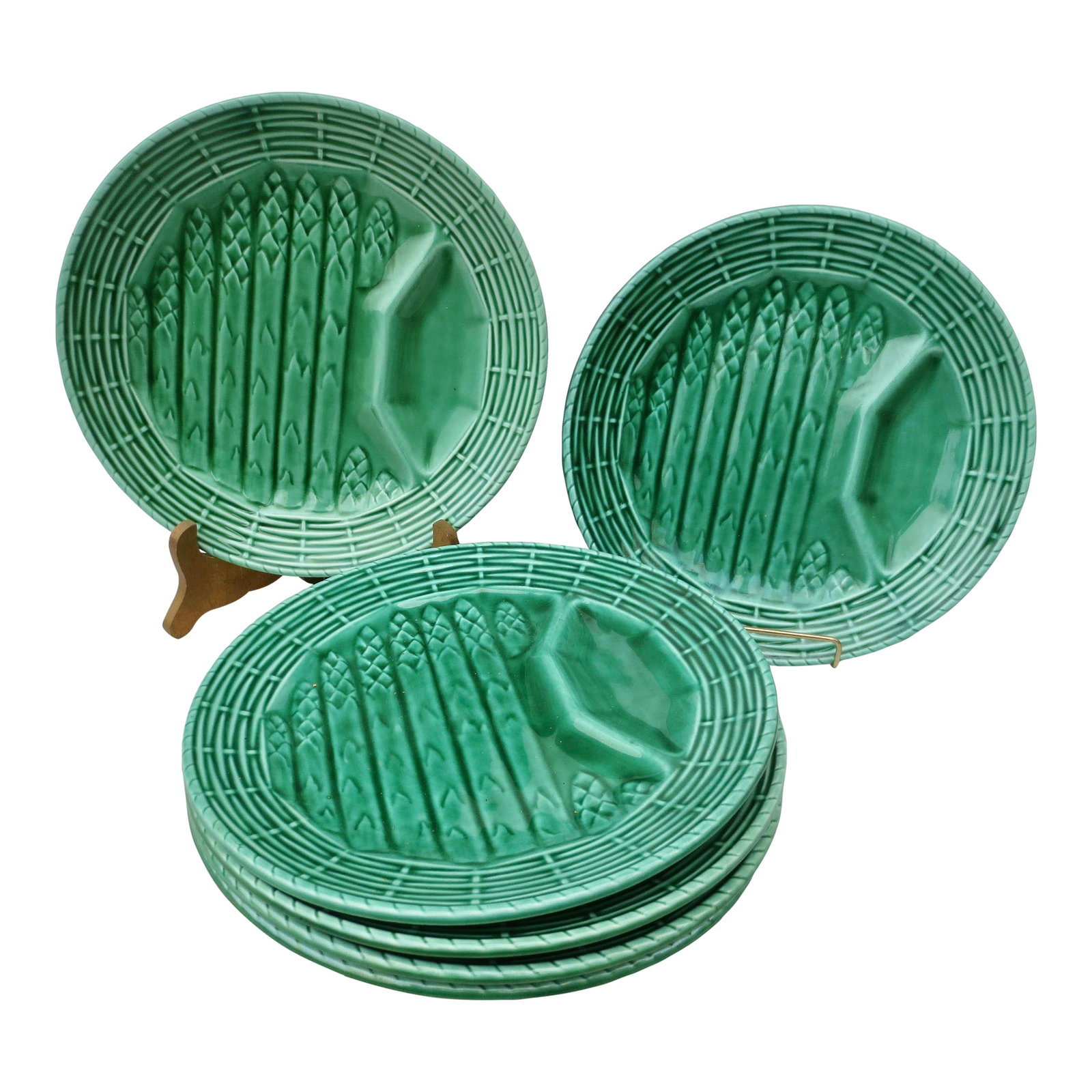 Sarreguemines Majolica Asparagus Plates- Set of 6: Sarreguemines majolica asparagus plates from France, made early to mid-20th century. The set is glazed in medium green glaze with sauce section and asparagus in parallel lines on a basket weave