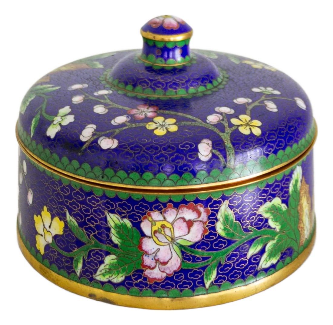 Blue and Polychrome Prunus Blossom Cloisonné Jewelry Catchall: A generously sized, round cloisonné box features a royal blue enamel ground with fine brass clouds throughout, accompanied by polychrome prunus blossoms, flowers, and leaves in pink and yellow.