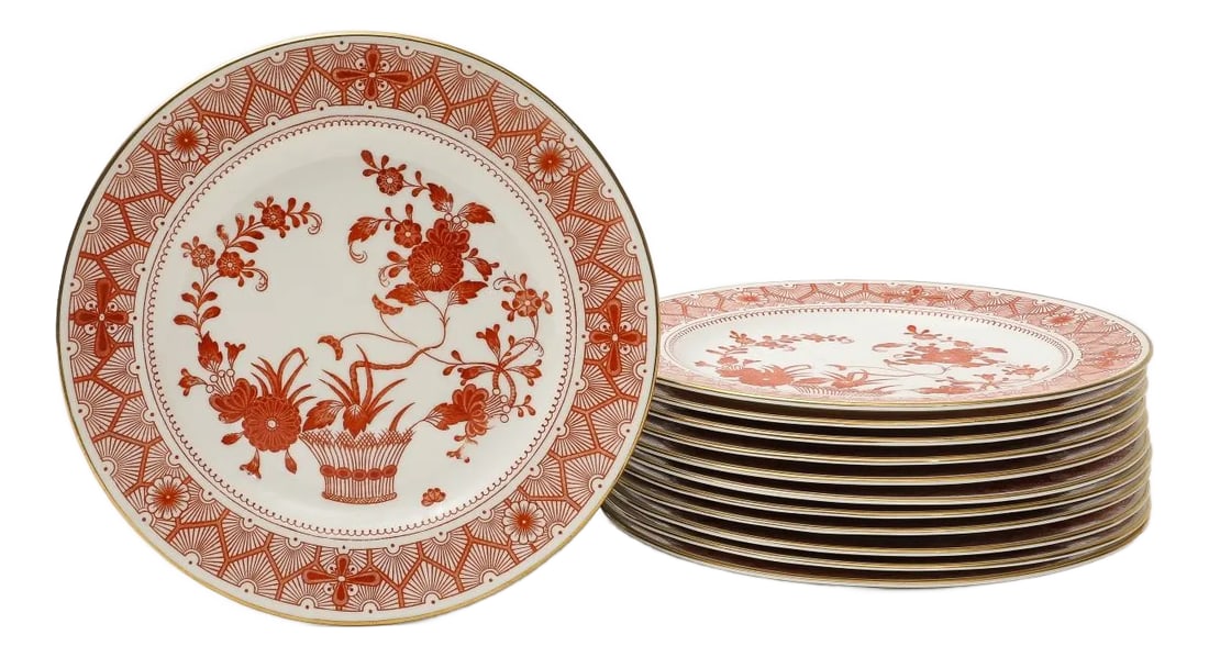 Royal Crown Derby Luncheon Plates, Chandos Pattern, Set of 12: Decorated in Japanese style in iron red glaze with a basket issuing flowers, with gilded rims. 9.25" diam x 0.5" H Condition: Alterations: Original Condition Unaltered Imperfections: Some