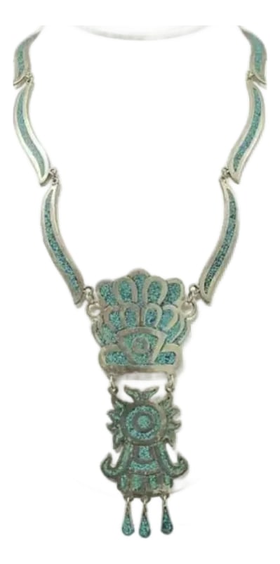 Mexican Alpaca Silver and Turquoise Inlay Necklace: Mexican Alpaca Silver and Turquoise Inlay Necklace. Necklace is made from Alpaca silver (an alloy of copper, nickel, and zinc) and features intricate turquoise inlay in a vivid hue. Necklace is design