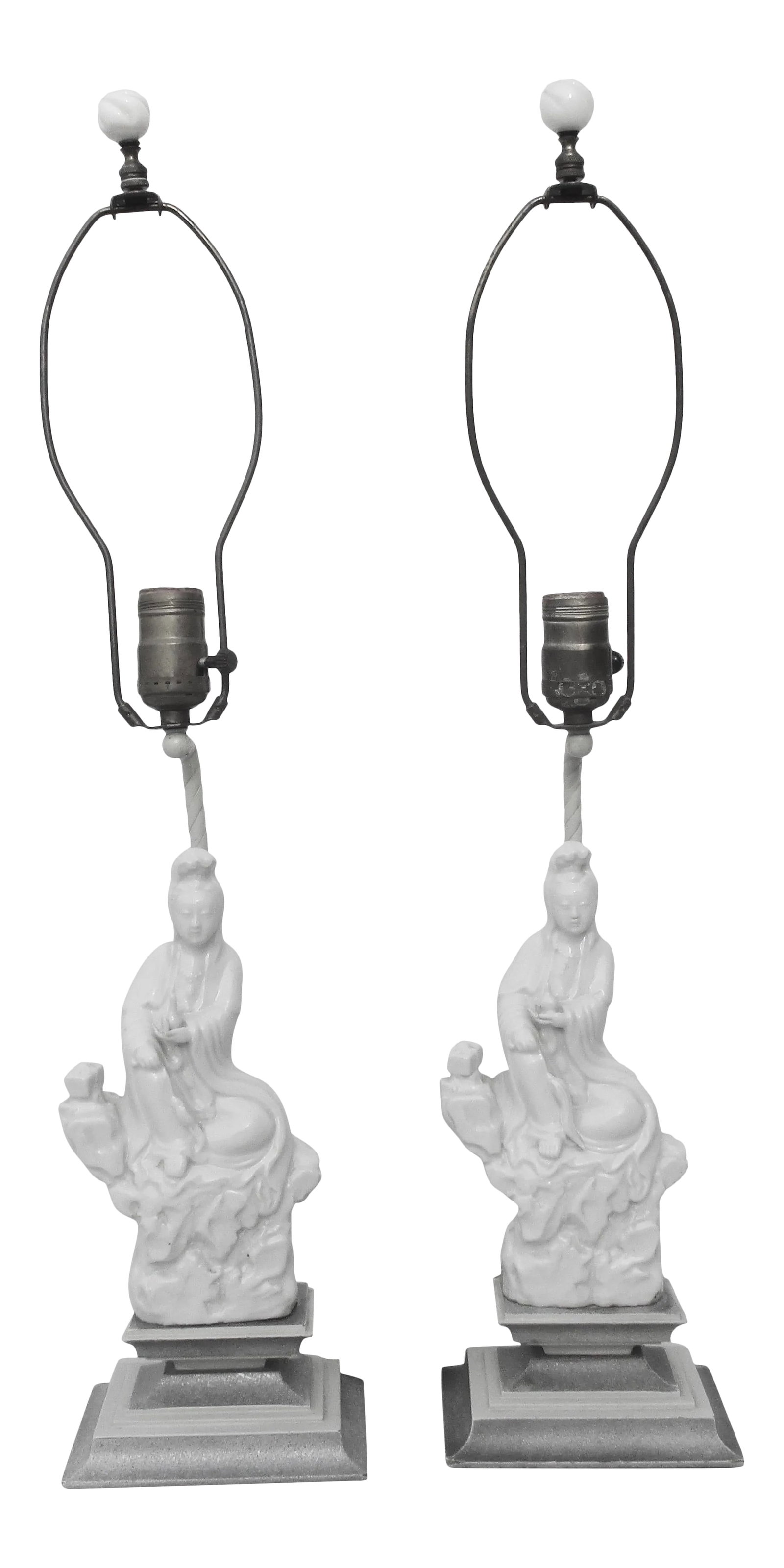 Vintage 1950s Chinese Blanc De Chine Lamps - a Pair: Vintage 50s' Blanc de Chine table lamps. Pair of Kuan Yin on rockwork porcelains mounted on stacked wooden pedestals painted in white and silver finishes. Wired through a brass rod attached to the
