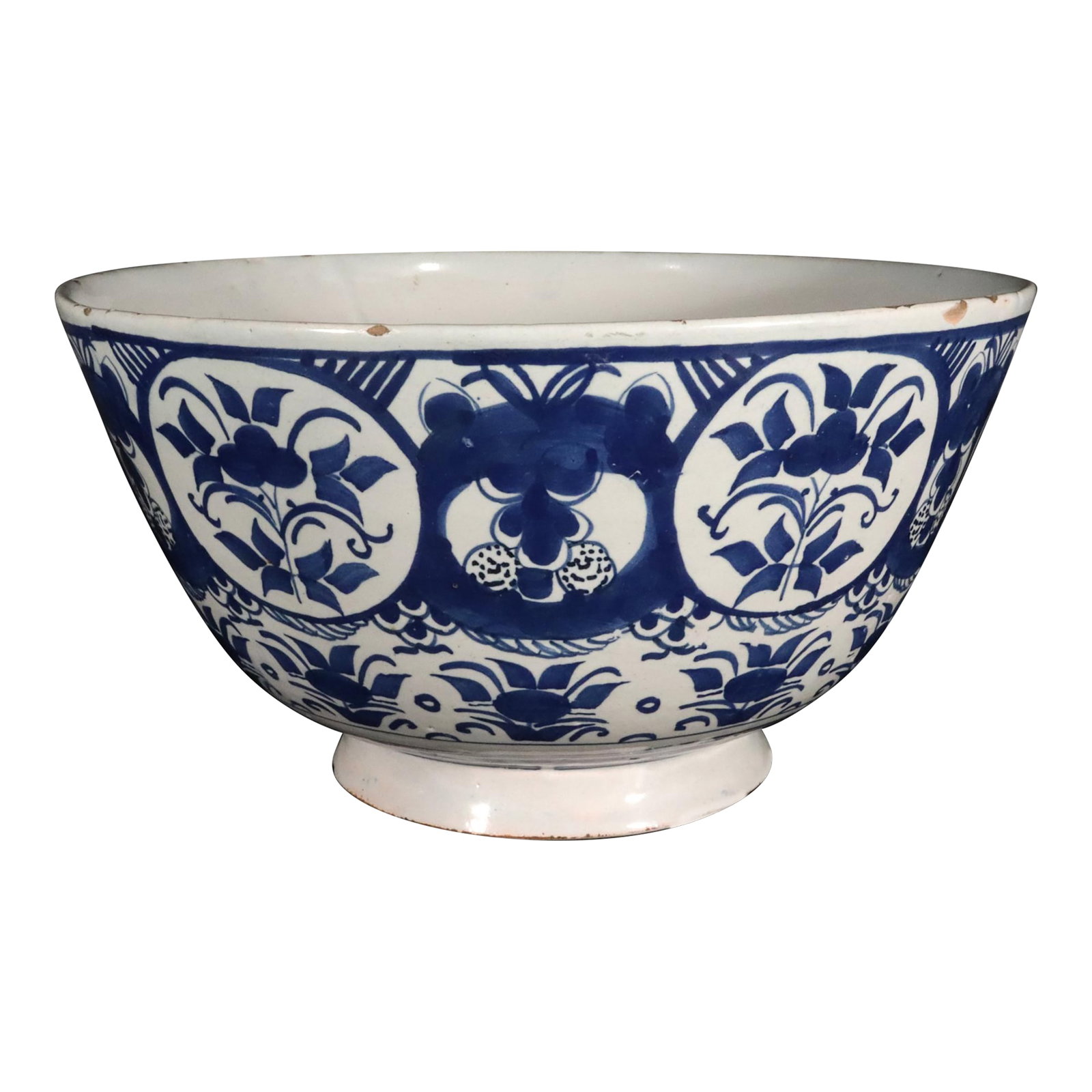 18th Century Dutch Delft Blue & White Chinoiserie Punch Bowl, Circa 1720: A wonderful Dutch Delft punch bowl from around 1720, painted in that deep, inky cobalt that made Delft famous, on a soft white tin glaze with all the warmth of three centuries. Around the outside,