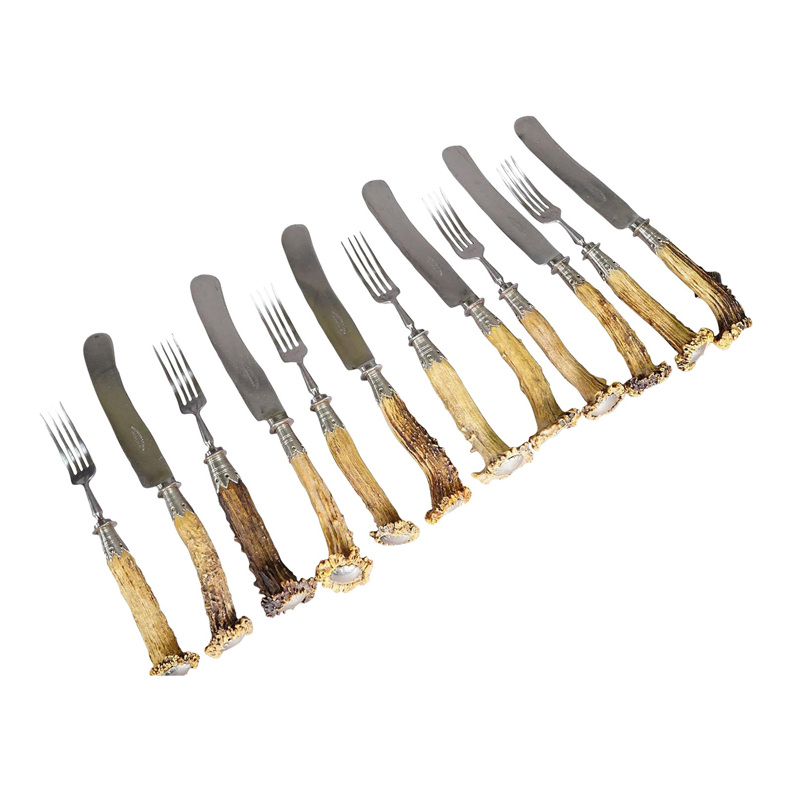 Vintage Stainless Steel and Horn Tableware Set for 6 Germany, 1900s: Vintage Stainless Steel and Horn Tableware Set for 6 Germany, 1900s A rustic tabelware set consisting of six knives and six forks. The handles are made of genuine deer horn and feature a silver knob o