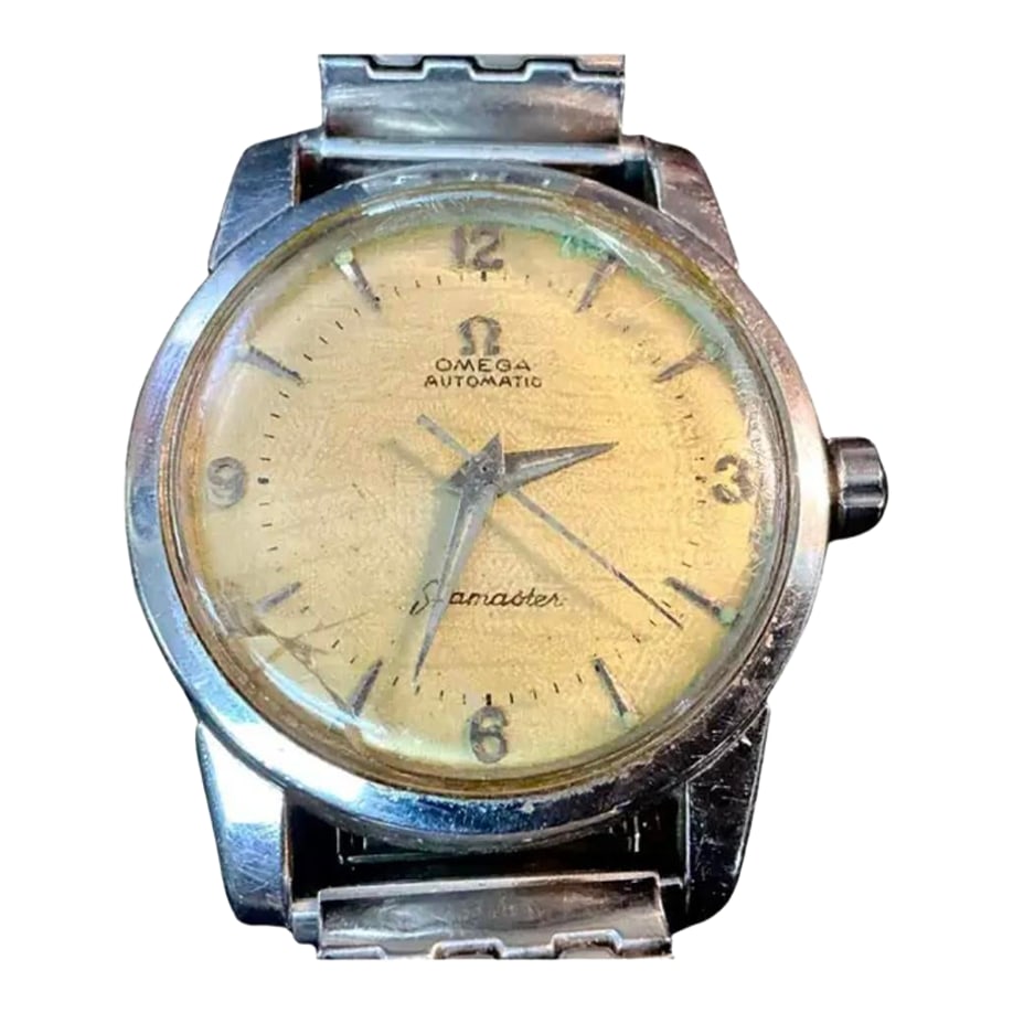Mid 20th Century Omega Seamaster Automatic Men's Watch: Vintage Omega Seamaster Automatic Men's Watch, circa 1950's. Stainless steel watch features a vintage Speidel USA stretch band with 34mm case and champagne colored dial background. The band was a