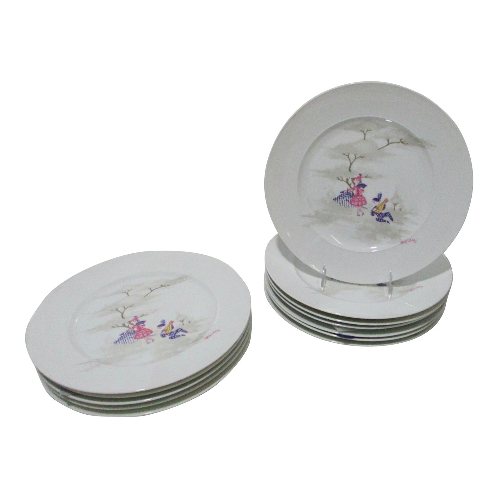 Mid 20th Century Rosenthal Dinner Plates by Bjorn Wiindblad - A Set of 12: Rosenthal Bjorn Wiinblad Set of 12 dinner plates measuring 11" in diameter. In a retelling of Pirot and Pirette, the little characters engage in a romantic moment by the fence. Hallmarked on the
