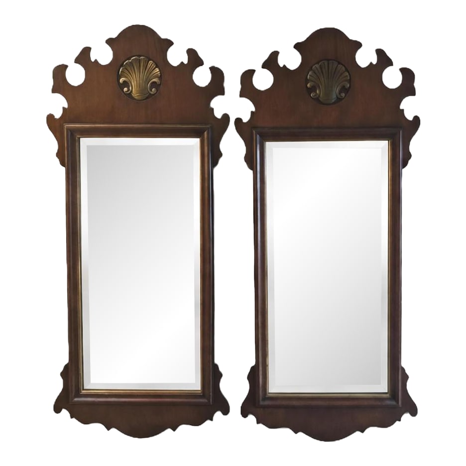 Pair of Henredon Warwick Chippendale Mahogany Wall Mirrors, Model 2402, Circa 1950s-1970s: Step into the hushed elegance of an English country manor with this captivating pair of vintage Henredon wall mirrors, crafted in the grand Chippendale tradition. Each mirror rises like a poetic