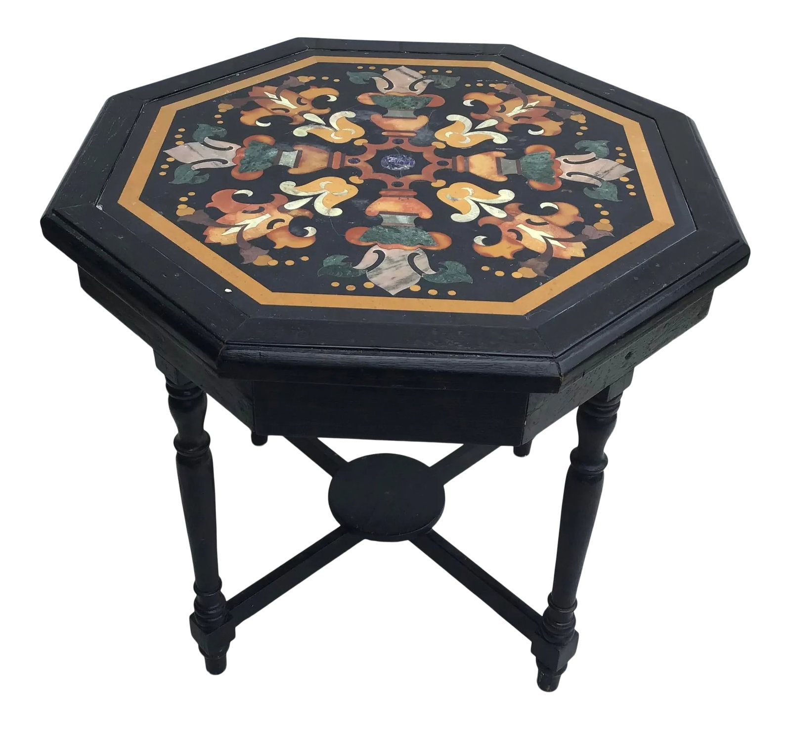 Antique Italian Pietra Dura Octagonal Center Table: A very fine Italian, 19th century Octagonal Pietra Dura Inlaid Table raised on an ebonized base with four drawers. The pietra dura inlaid top depicting a stylized design with colorful marble inlaid