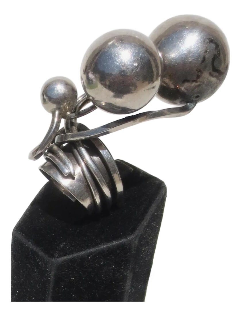 Sterling Silver Modernist Ring by Rachel Gera: Sterling silver modernist construction of sculptural elements designed around rising spheres of silver wound around a silver band and moving like balloons up the hand. Modernist jeweler Maker in