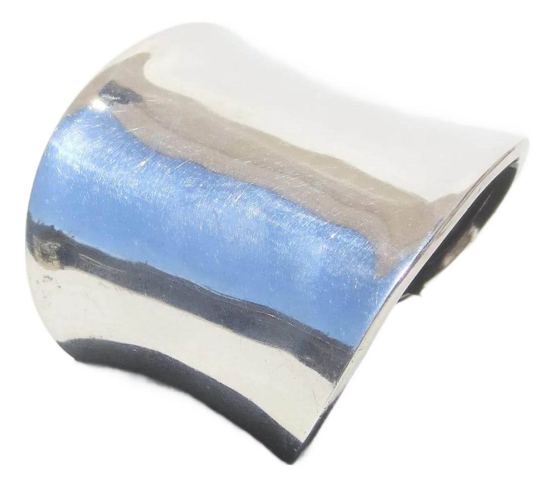 Sterling Silver Modernist Cuff: Modernist Sterling silver cuff marked 925 TD-25 Mexico. Mirror gloss measures 6.5 on gauge. The weight is 40 Dwt. The width is 2.4" and across the opening is 2.5". circa 80s. INV SFB 40 Condition: