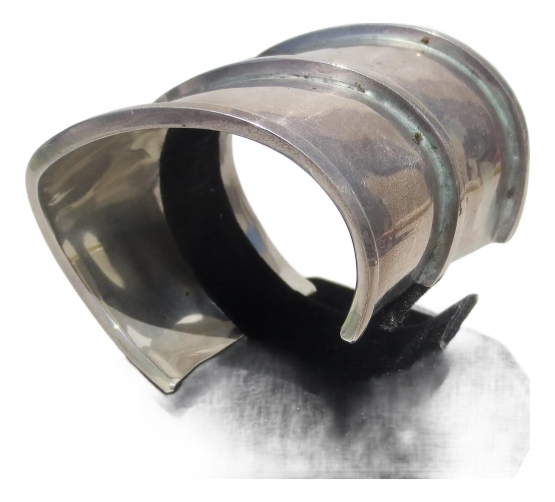 Sterling Silver Cuff by Bartels: Bartels sterling silver cuff, Modernist wave design. Organic curve and wide sleeve. The measurements are 6.8". The width is 2" and 2.3" across. Polished silver, weight is 48.7 Dwt. INV K-29
