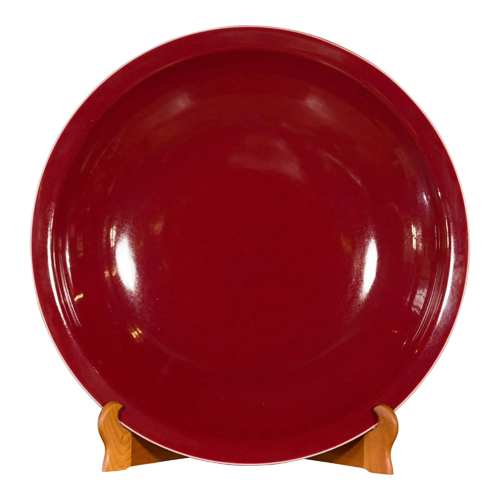 Chinese Vintage Large Porcelain Platter with Oxblood Color: A large Chinese vintage porcelain platter from the mid-20th century, with oxblood color. Created in China during the mid-century period, this porcelain platter captures our attention with its elegant
