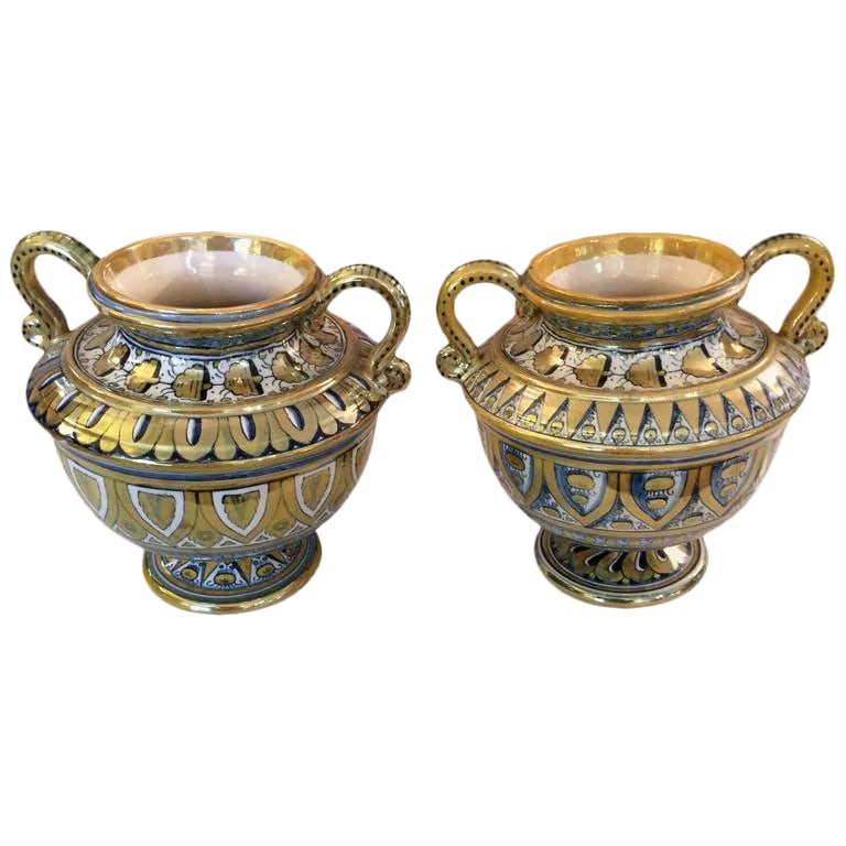 Small Italian Lusterware Compotes Urns - A Pair: Lovely pair of compotes with urn shape and curved handles, having gorgeous white, gold and navy blue intricate pattern. DIMENSIONS 7.25 in.H 18 cmH DIAMETER 7.5 in. (19 cm) Condition: Condition