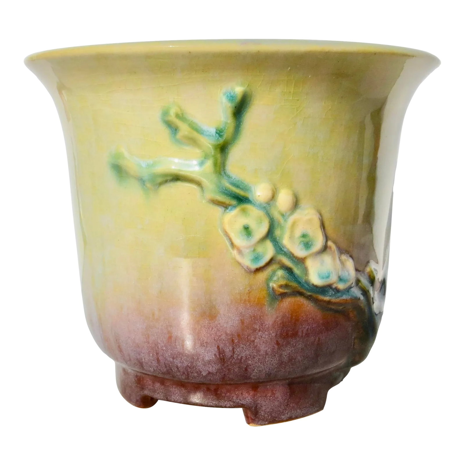 Roseville Art Deco Planter Circa 1930s': Beautifully shaded Roseville Art Deco planter in great shape, always used as a cache pot. Oriental Prunnis branches on each side with a smooth shifting of color from yellow to mauve at the base. Stand
