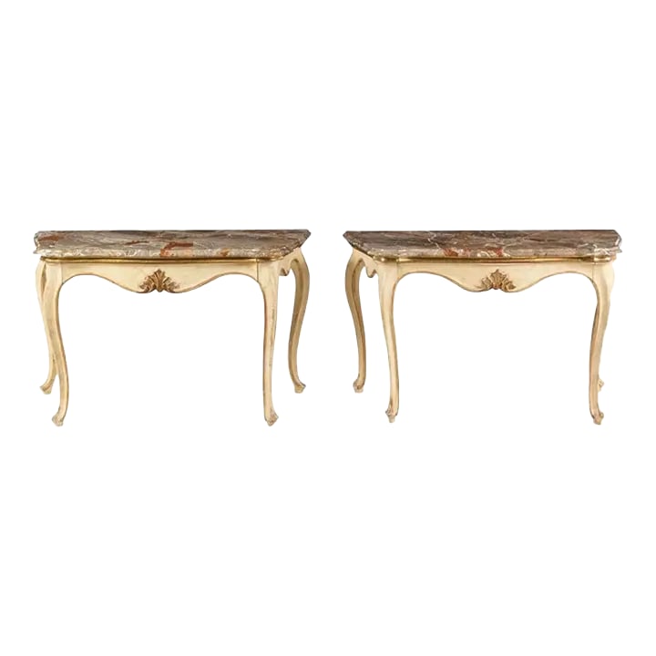 Pair of 19th Century Italian Painted and Gilt Marble-Top Console Tables: Fine pair of 19th century Italian rococo console tables, fine breche marble tops over scalloped sides and molded edge with carved gilt shell in center of aprons, which each have a single drawer.