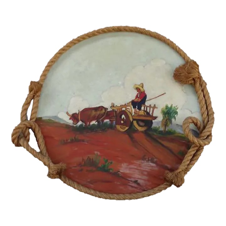 1930s Folk Art Mexican Scene Painted on a Round Wooden Tray C 1930s: Absolutely delightful in its rustic rope frame. Really well painted too. Expertly done. Artist unknown. Measures 14 3/4" x 15 1/2". Condition: Alterations: Original Condition Unaltered Imperfections: 