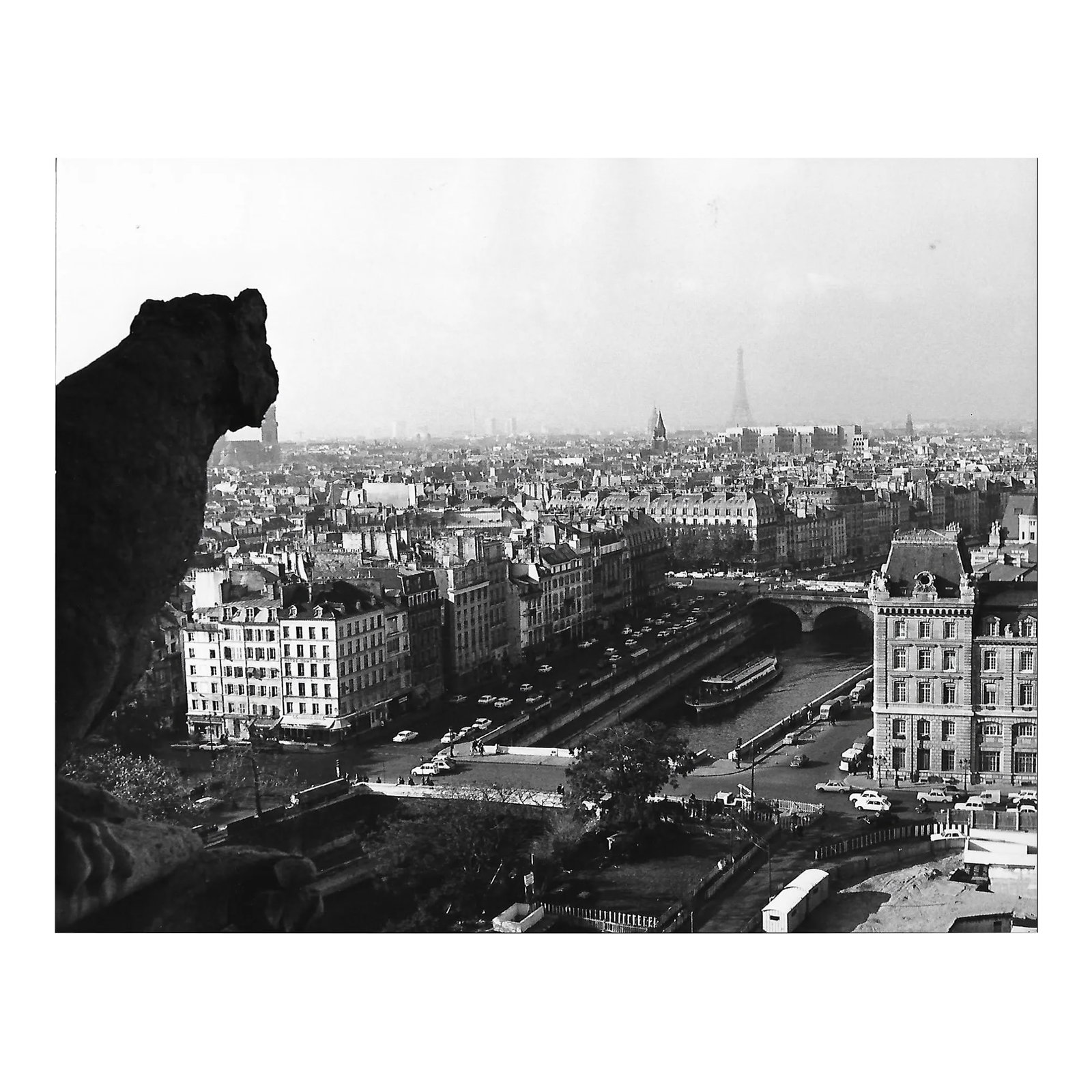 1971 View of Eiffel Tower From the Top of Notre Dame Paris Photograph by Don Ware: 1971 black and white photo by Los Angeles, California by Don Ware of the Seine and the Eiffel Tower from the top of Notre Dame Cathedral. Title, dated and bearing Ware's studio stamp on the back. Cond