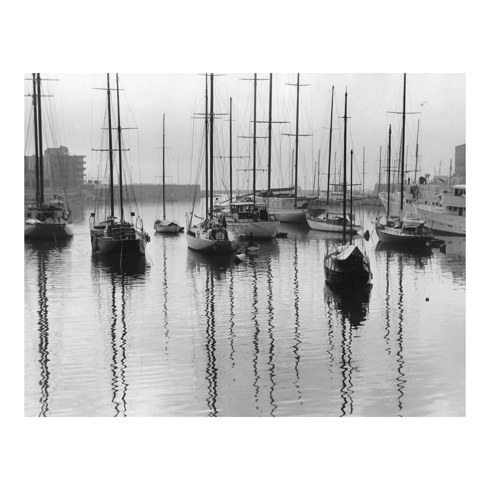 1964 Greek Harbor With Sailboat Photograph by Don Ware: Harbor of Piraeus, Greece, a city within the Athens metro area b&w photo by Don Ware (1921-2006). Title and Ware's stamp on back. Condition: Alterations: Original Condition Unaltered Imperfections: