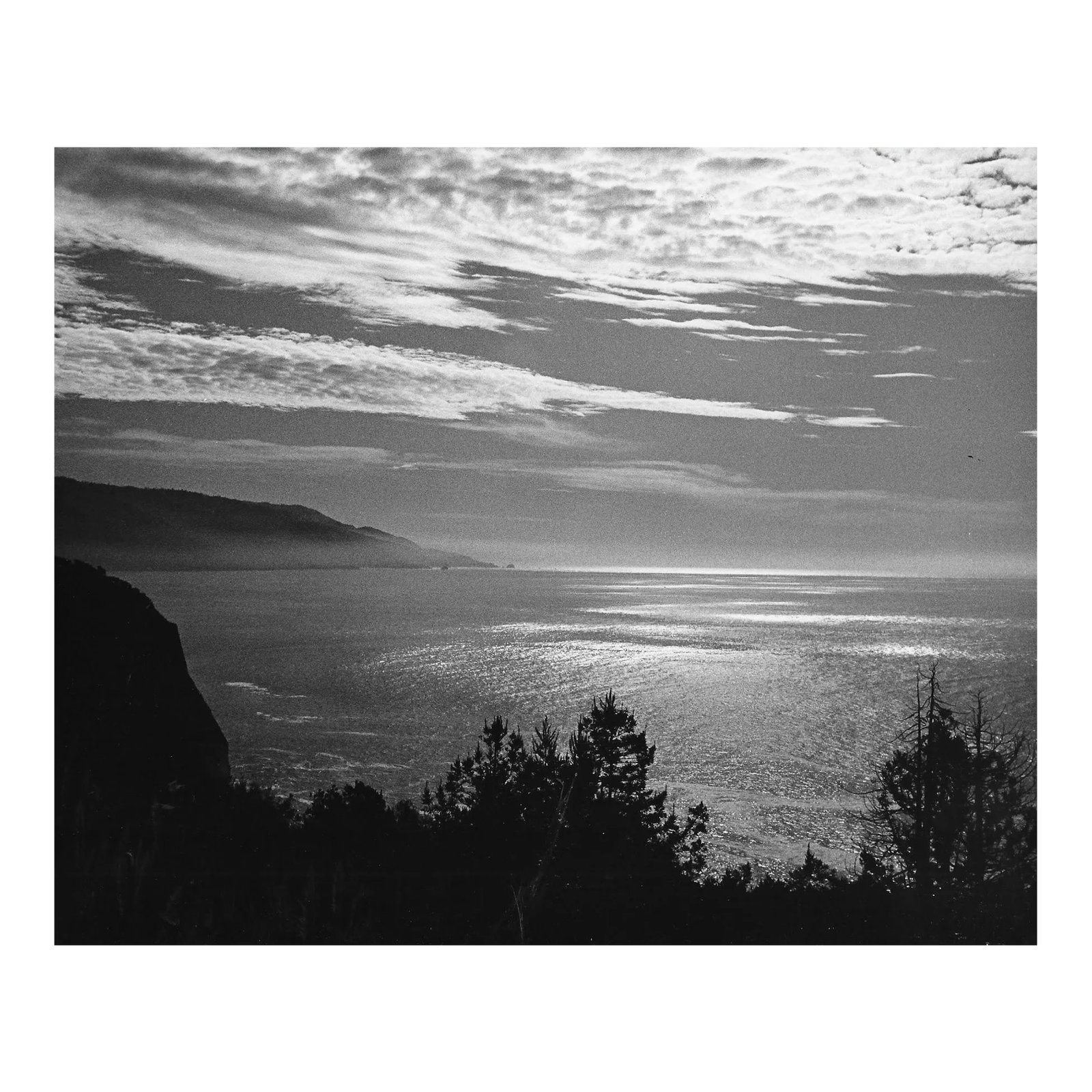 1974 Pacific Ocean Near Big Sur Photograph by Don Ware: 1974 black and white photograph by Los Angeles based photographer Don Coleman Ware (1921-2006) of the Pacific near Big Sur on the California coast. Titled. dated and bearing Ware's studio stamp on the