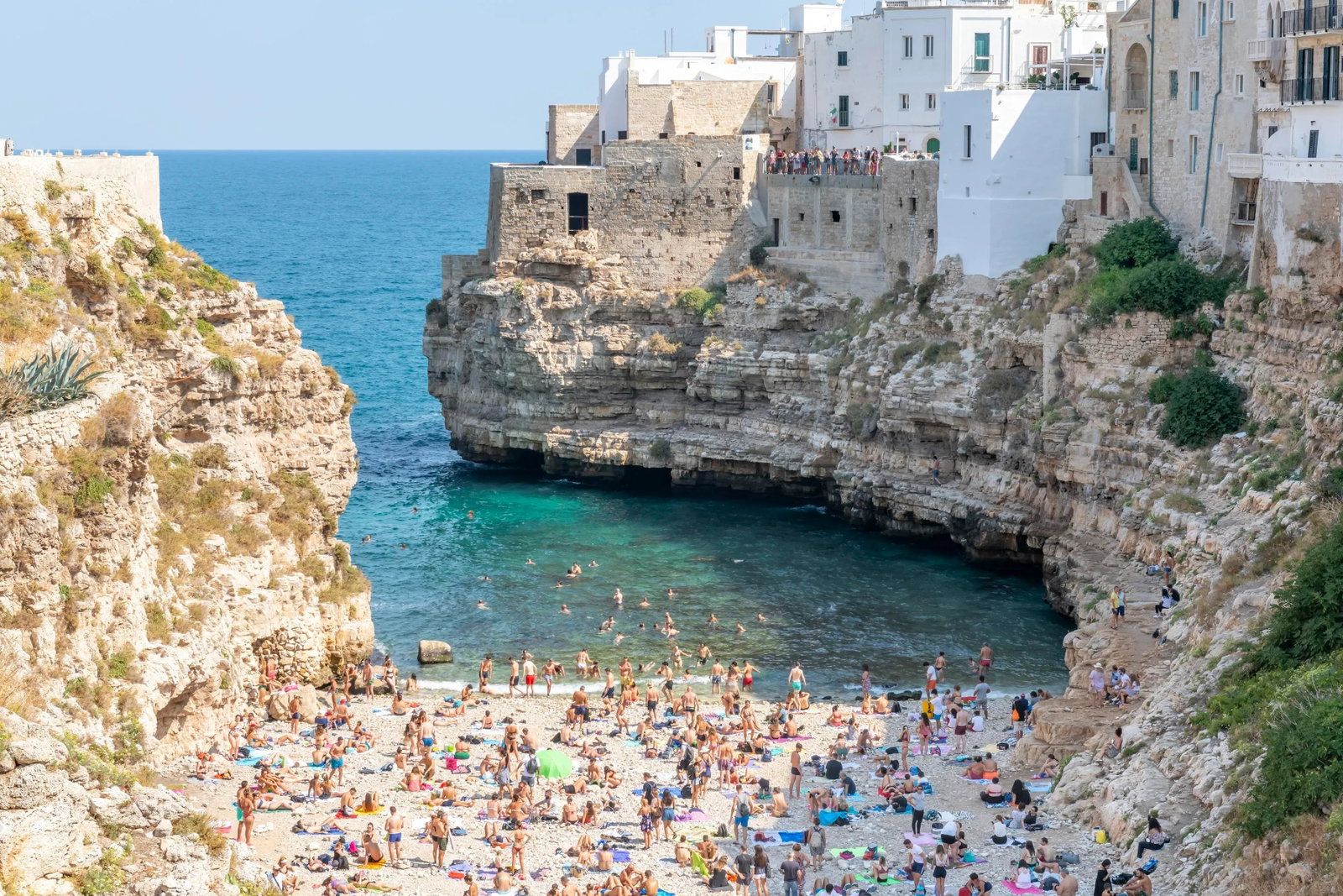 The Polignano a Mare in Puglia, Italy, Photograph by Richard Silver: One of Italy's most photographed spots, the white-washed buildings of Polignano a Mare stand guard over a spectacular Adriatic cove. One of Italy's most photographed spots, the white-washed buildings