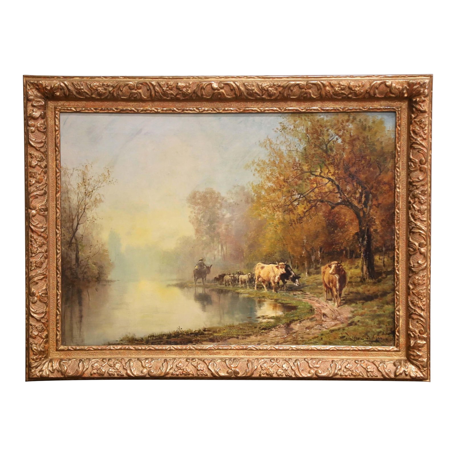 19th C. French Oil Painting With Herd in Carved Frame Signed Theodore Levigne: This antique oil on canvas painting by Theodore Levigne (1848-1912) captures a tranquil riverside scene at sunrise, as a herder leads cattle and sheep along a winding path beneath golden autumn