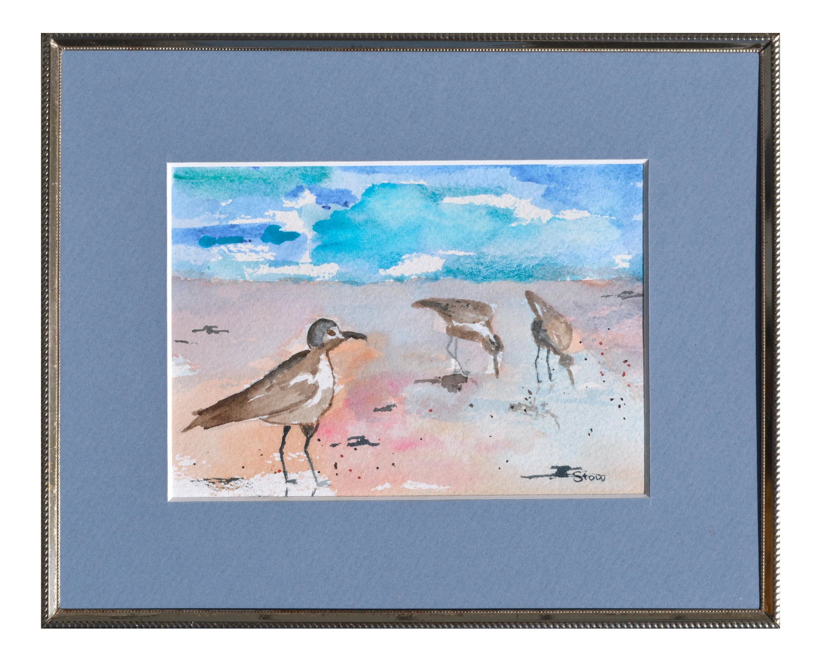 Maryann Stow Florida Seabirds Watercolor Landscape circa 1980: Serene watercolor of coastal Florida by an unknown artist named Stow (American, 1955-2016). Signed "Stow" in the lower left corner. Presented in a blue mat with a simple metal frame with glass. Image