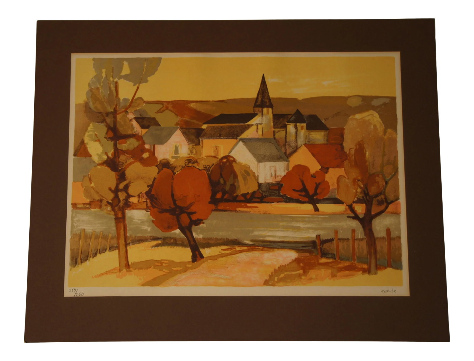 1960s Provincial French Village Lithograph Numbered 257/260 by Elaine Thiollier: Beautiful limited edition lithograph depicting a French village by renowned French lithographer Eliane Thiollier. Her work has been described by critics as bathed in gilded light, pierced with scarlet