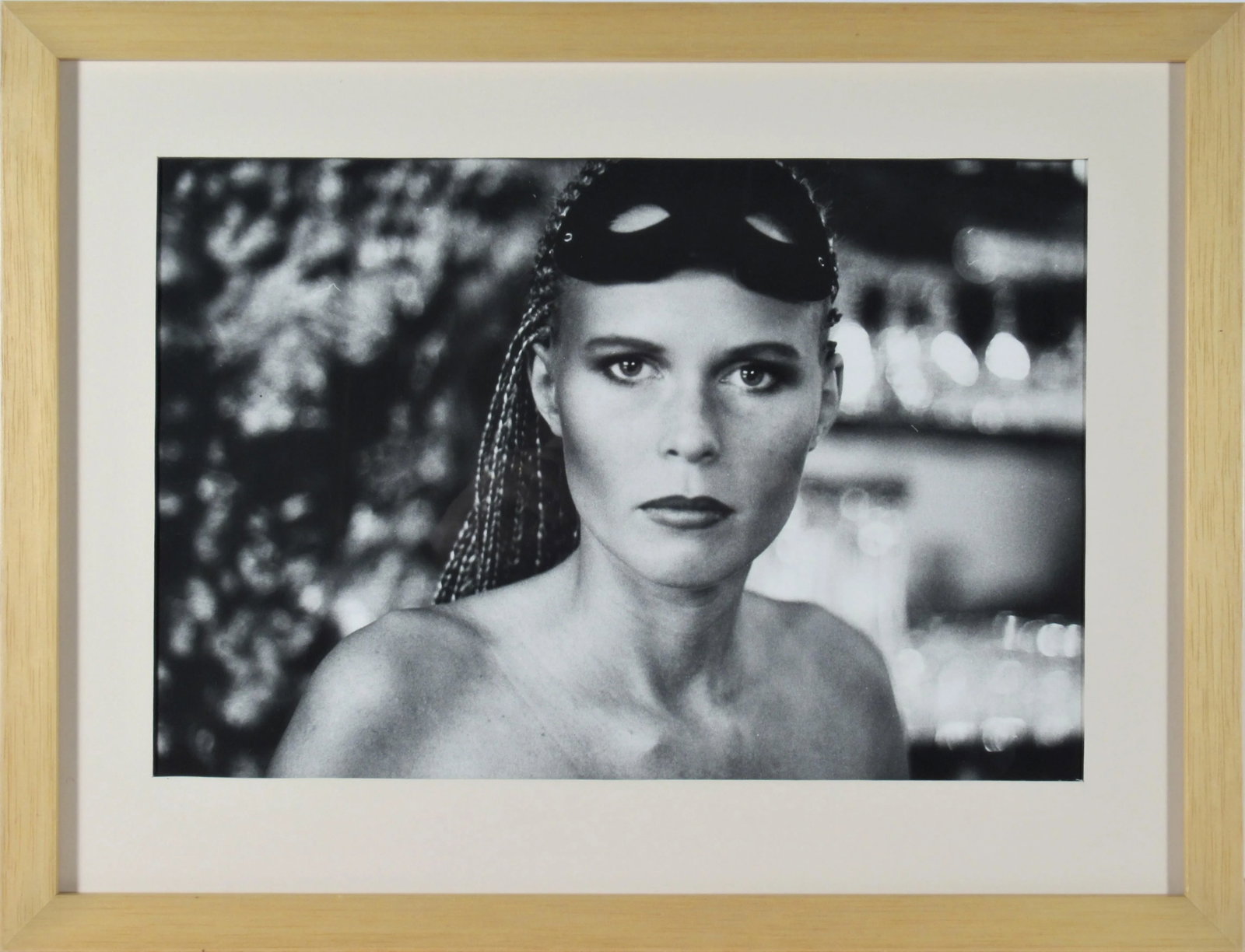 Michael Andreas Russ, Woman with Mask, Circa 1980: This photograph "Woman with Mask" c.1980 is an original gelatin silver print by famous German photographer and artist Michael Andreas Russ, born 1945. The photograph size is 8.35 x 12.75 inches,