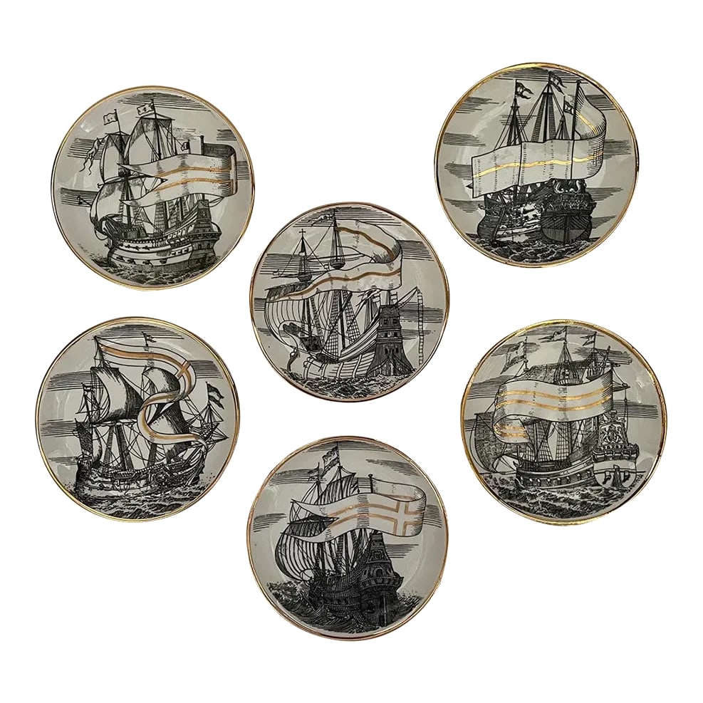 1960s Velieri "Tall Ship" Coasters by Piero Fornasetti - Set of 6: Set of 6 ''Velieri'' porcelain coasters / small plates designed by Italian artist Piero Fornasetti in the 1960s. All plates have a different black and white lithograph of a tall ship with metallic
