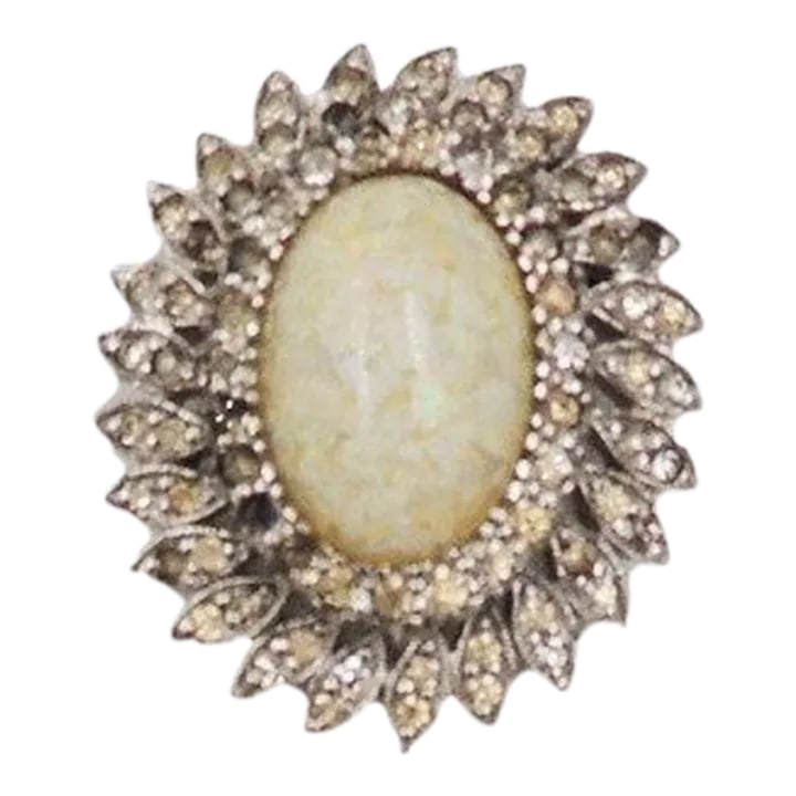 Vintage 1960s Panetta Rhodium Plate Faux-Opal & Clear Rhinestone Brooch & Pendant: This is part of Chairish's Costume Jewelry assortment. 1960s rhodium plated cabochon faux-opal and clear rhinestone brooch with security clasp that can be worn as a pendant. Marked "Panetta." Measures