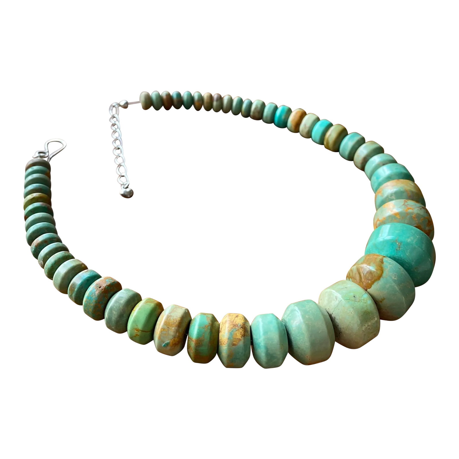 Modernist Graduated Turquoise + Sterling Silver Necklace: Modernist, barrel-carved turquoise and sterling silver necklace. Weighty, rich feel and truly luxurious aesthetic. One miniature sterling heart punctuates the adjustable chain closure. Total length