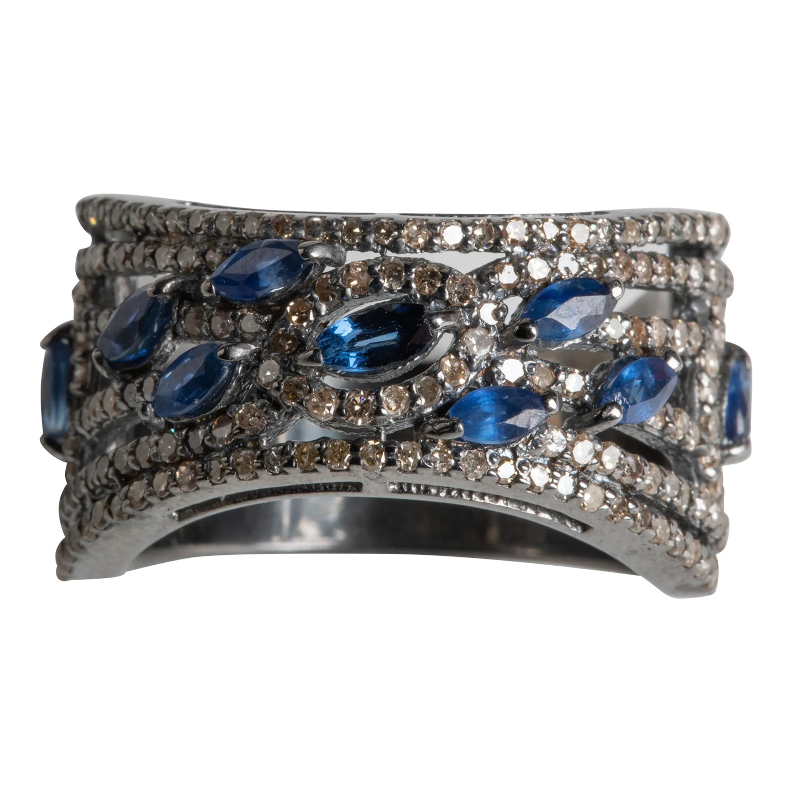 1990s Marquise Blue Sapphire and Diamond Ring: This is part of Chairish's Fine Jewelry Collection. 9 marquise cut blue sapphires set among round, brilliant cut, pave`-set diamonds. In an oxidized sterling silver. Carat weight of sapphires total 1