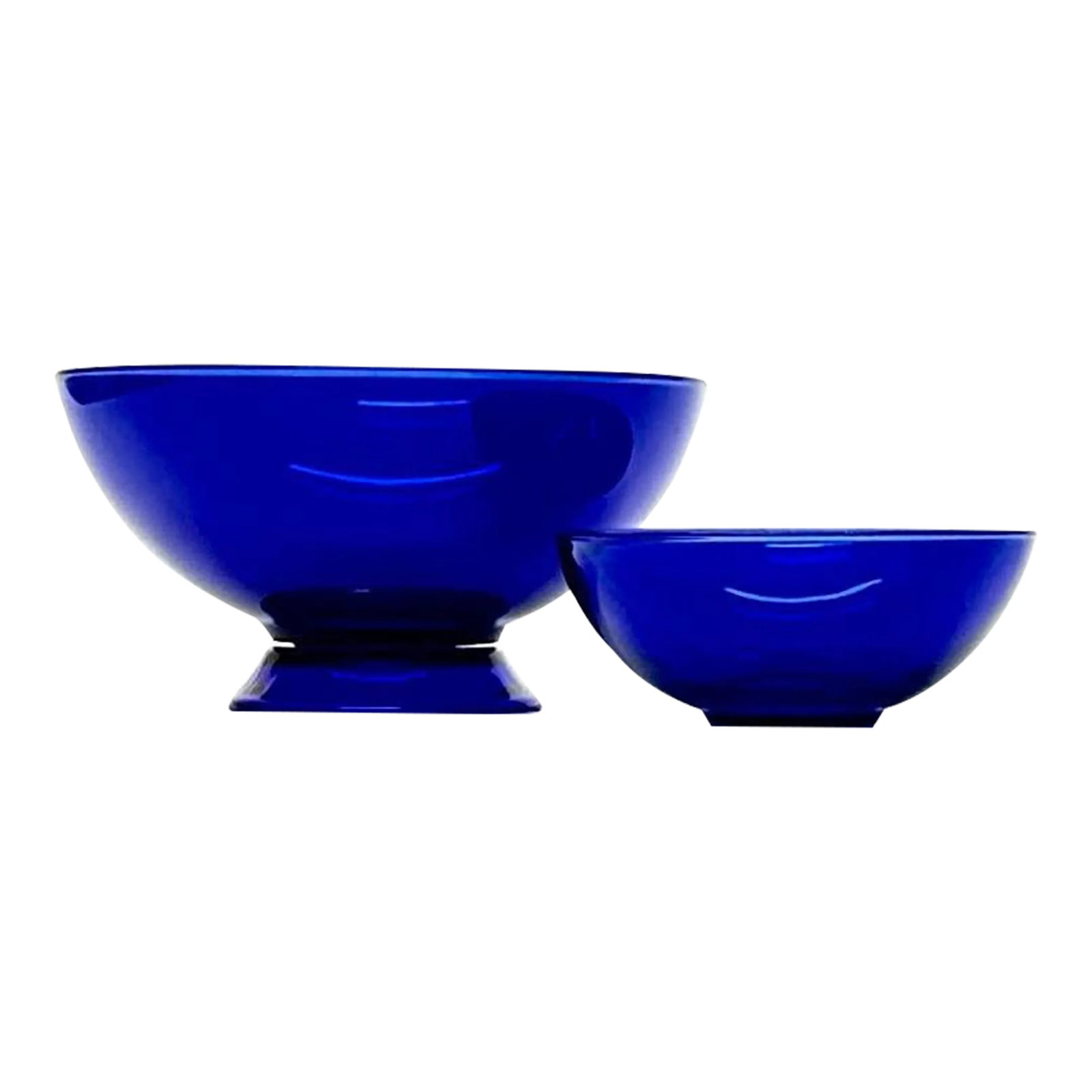 Cobalt Glass Bowls - Group of 2: Cobalt glass bowls, group of 2. A gorgeous set of blue bowls from the mid-20th century. Shortest: 2.25"H Tallest: 4"H Condition: Alterations: Original Condition Unaltered Imperfections: Some