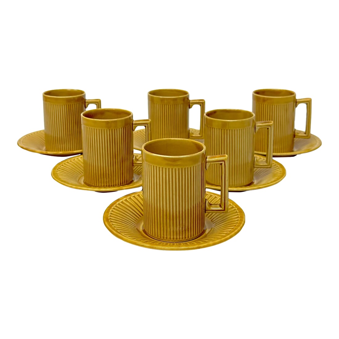 Mid-Century Mustard-Colored Coffee Cups & Saucers by Tiko England - Set of 6: Mustard cups and saucers, group of 6. This glazed set of cups and saucers made in England by Tiko, have the casual look and feel of pottery but are in fact made of fine porcelain. Featuring a