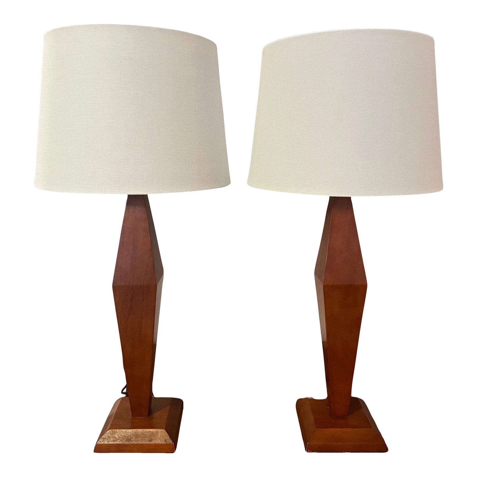 American Art Deco 1940s Wood Table Lamps - A Pair: Pair of streamlined American Art Deco carved wood table lamps with aged brass double sockets and brown cloth cords. Rewired. We can offer the shades as a reference. Voltage: 110-150v Condition: