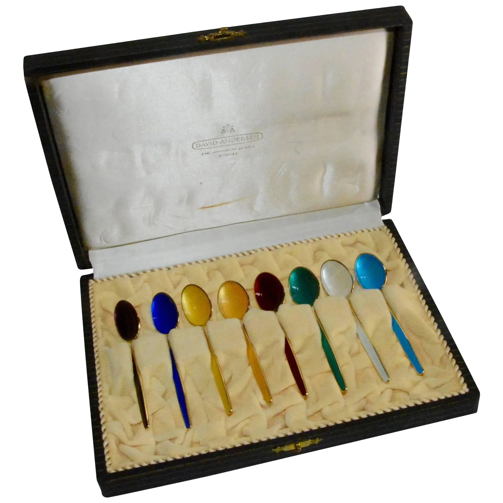 David-Andersen Norwegian Sterling Silver and Enamel Demitasse Spoon Set in Case: This is a beautiful set of Norwegian sterling silver spoons by David-Andersen. This collection includes eight spoons with enamel inlays of purple, cobalt blue, yellow, teal, ruby red, white, and