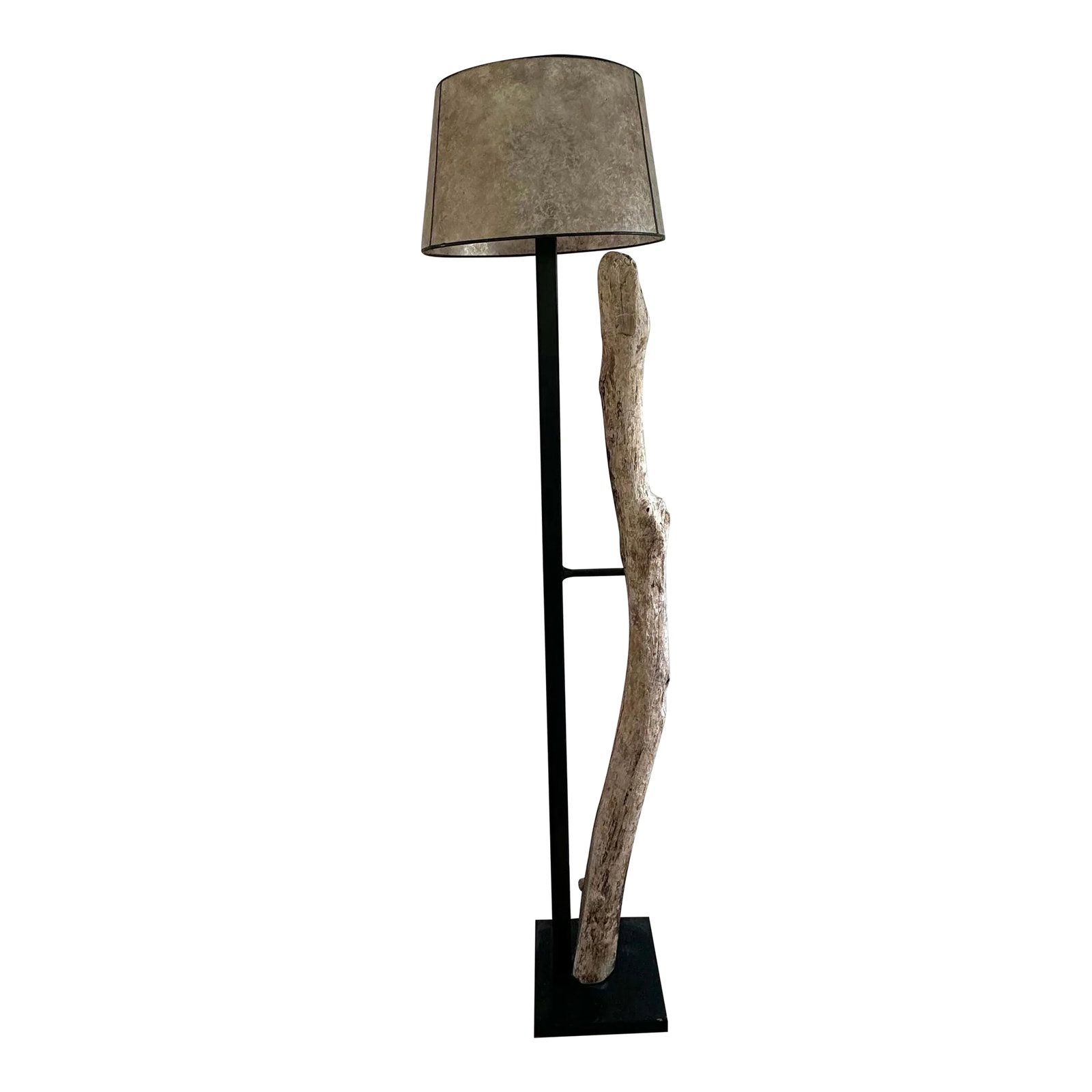 Rustic Kennebunkport Driftwood Floor Lamp: This unique floor lamp features a rustic driftwood piece sourced from Kennebunkport ME, naturally textured and curved, mounted on a sleek black metal frame. It is paired with a large, round lampshade