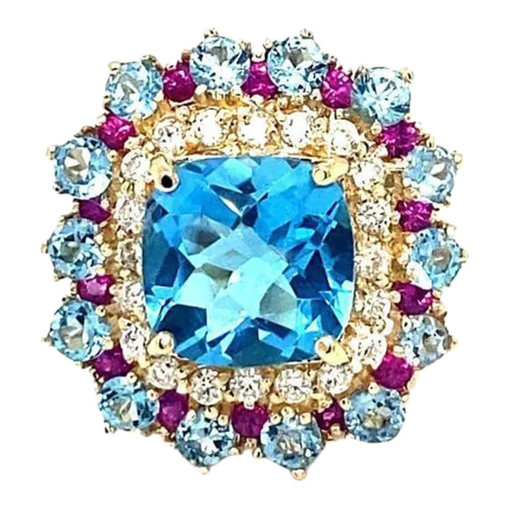6.41 Carat Cushion Cut Blue Topaz Sapphire Diamond Yellow Gold Cocktail Ring Size 7: This is part of Chairish's Fine Jewelry assortment. This is part of Chairish's Fine Jewelry assortment. 6.41 Carat Blue Topaz Sapphire Diamond Yellow Gold Cocktail Ring Beautiful to say the Least!
