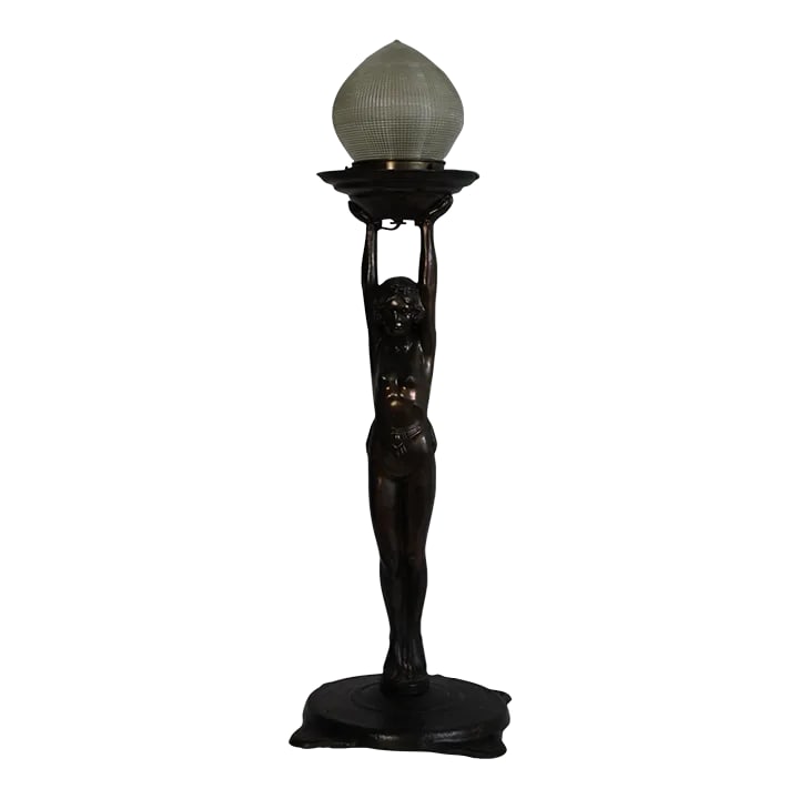 1920s Everlite Art Deco Lamp: Everlite Art Deco Beautiful sculptural figure. Burnished copper /bronze finish Vintage Holophane. Glass shade that emits radiant rays of light. Back of the foot is marked Everlite MFG. There is a hole